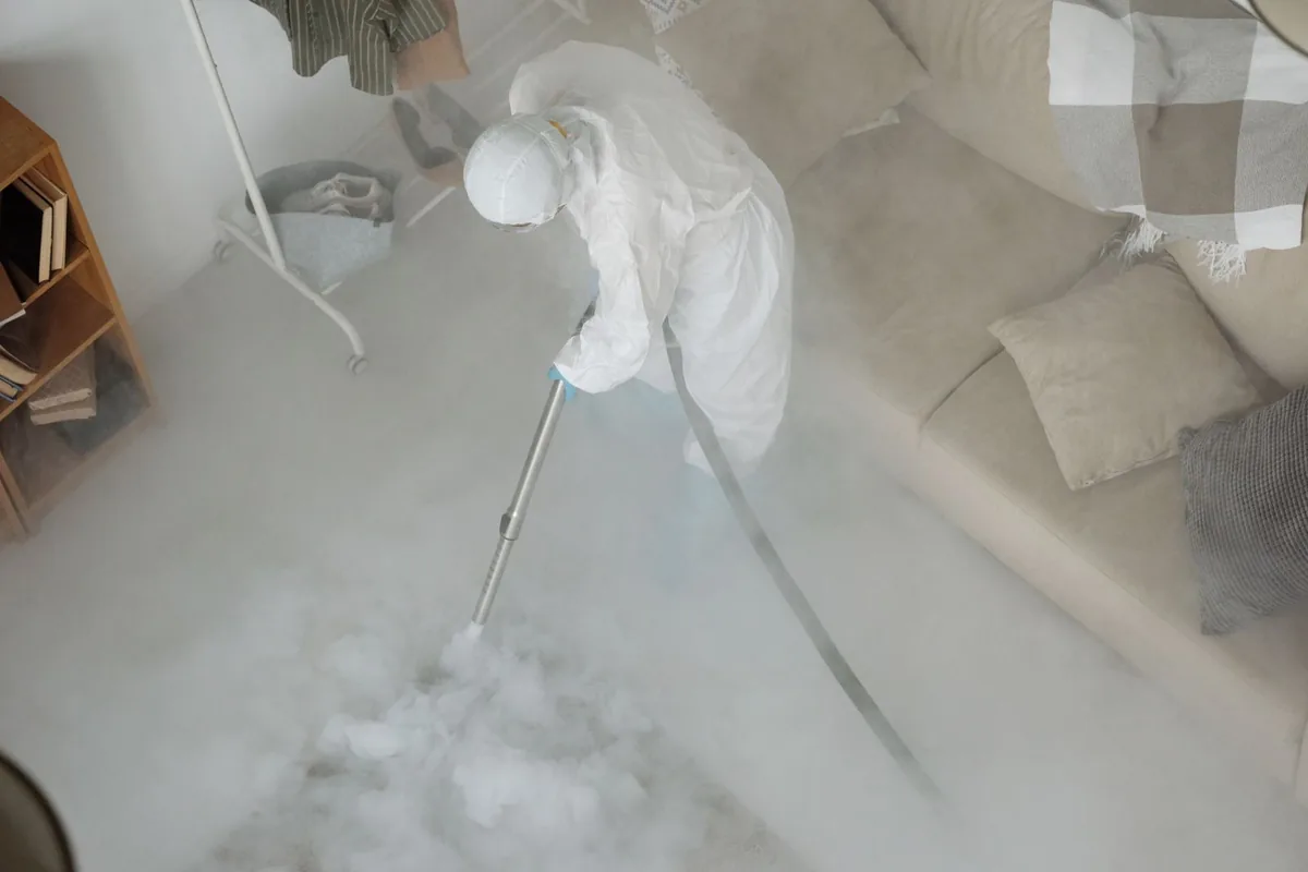 Biohazard cleanup technician in protective equipment, East Douglas, MA